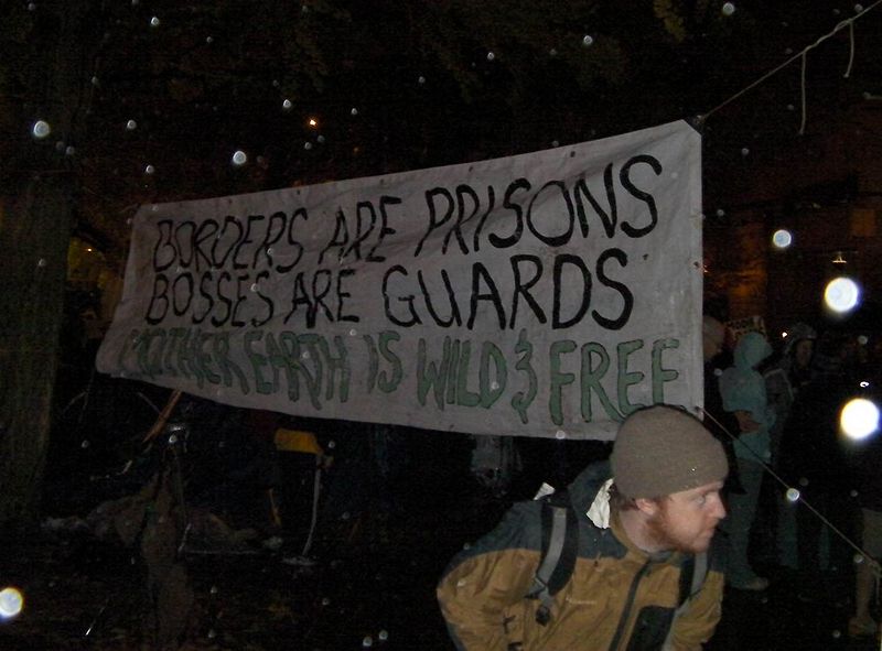 File:Borders Are Prisons Bosses Are Guards Mother Earth Is Wild And Free.jpg