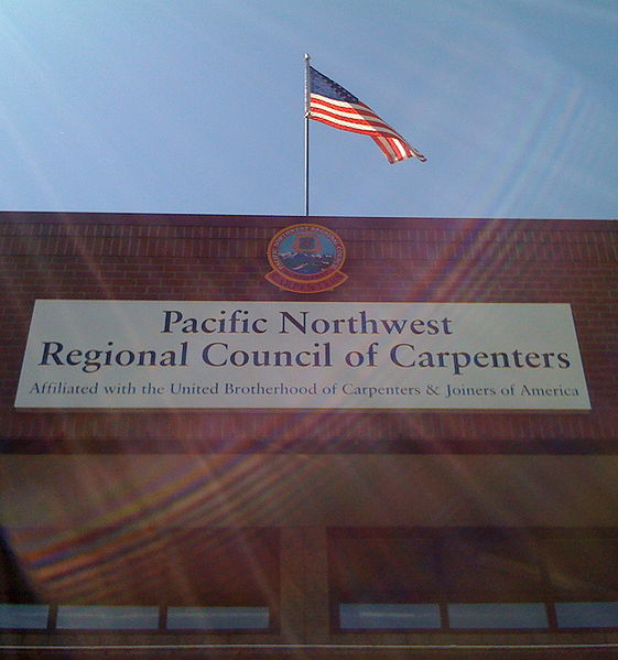 File:PacificNWCarptersBuildingNowSignCentered.JPG