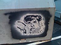 A more sophisticated stencil art graffiti, but we can't be sure it is from PDX artists - because of the dumpster status.